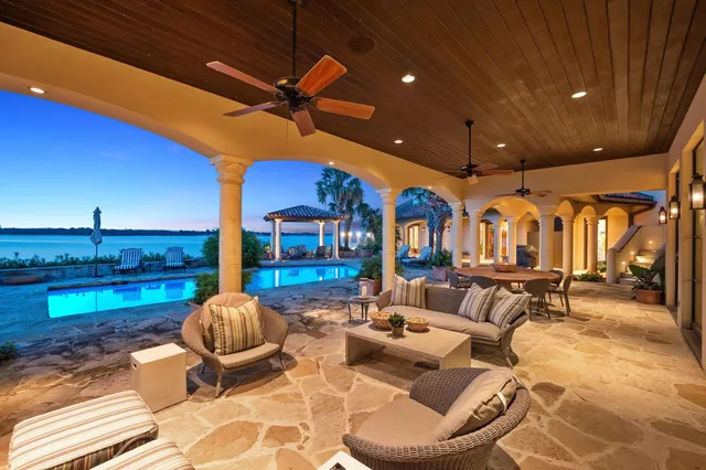 a living room with furniture a rug and a fireplace