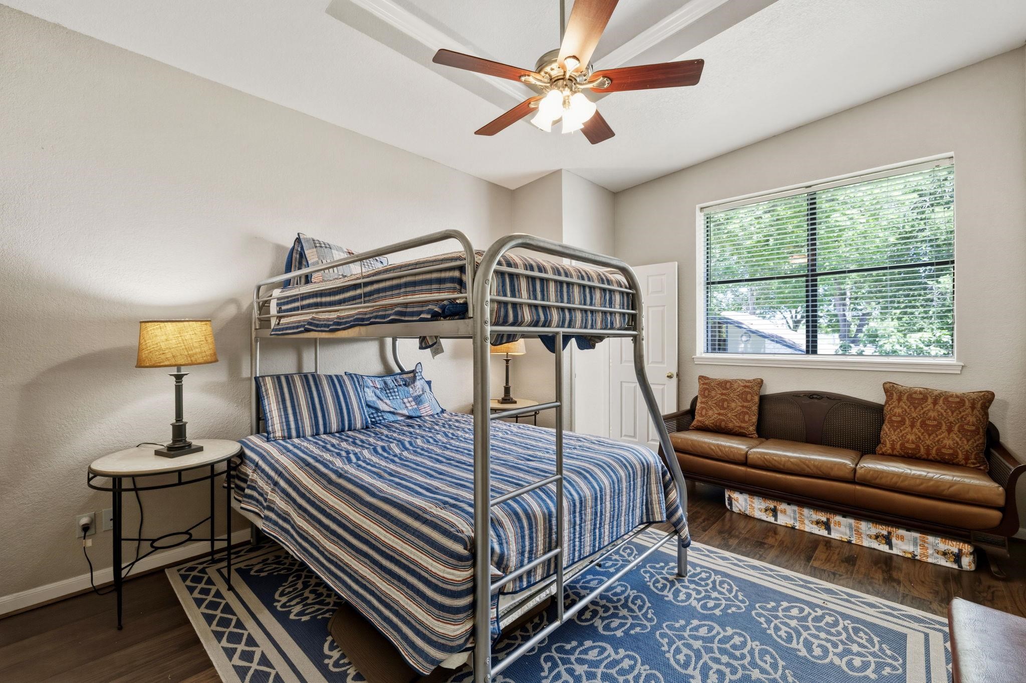 1435 East Zipp Road New Braunfels, TX 78130 - Photo 38 of 43 a bedroom with a bed next to a window