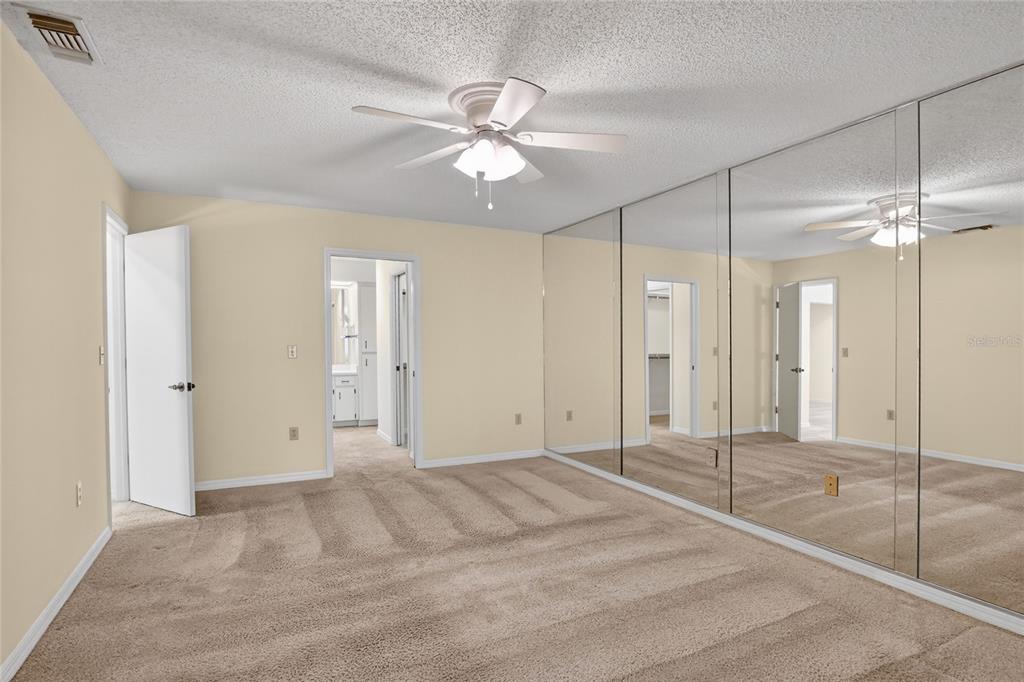 2025 Sylvester Road, Unit H3 Lakeland, FL 33803 - Photo 22 of 49 a view of a livingroom with a ceiling fan and closet area