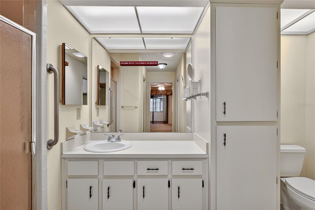 2025 Sylvester Road, Unit H3 Lakeland, FL 33803 - Photo 23 of 49 a bathroom with a sink vanity granite and a mirror