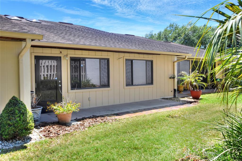 2025 Sylvester Road, Unit H3 Lakeland, FL 33803 - Photo 37 of 49 a front view of a house with a yard