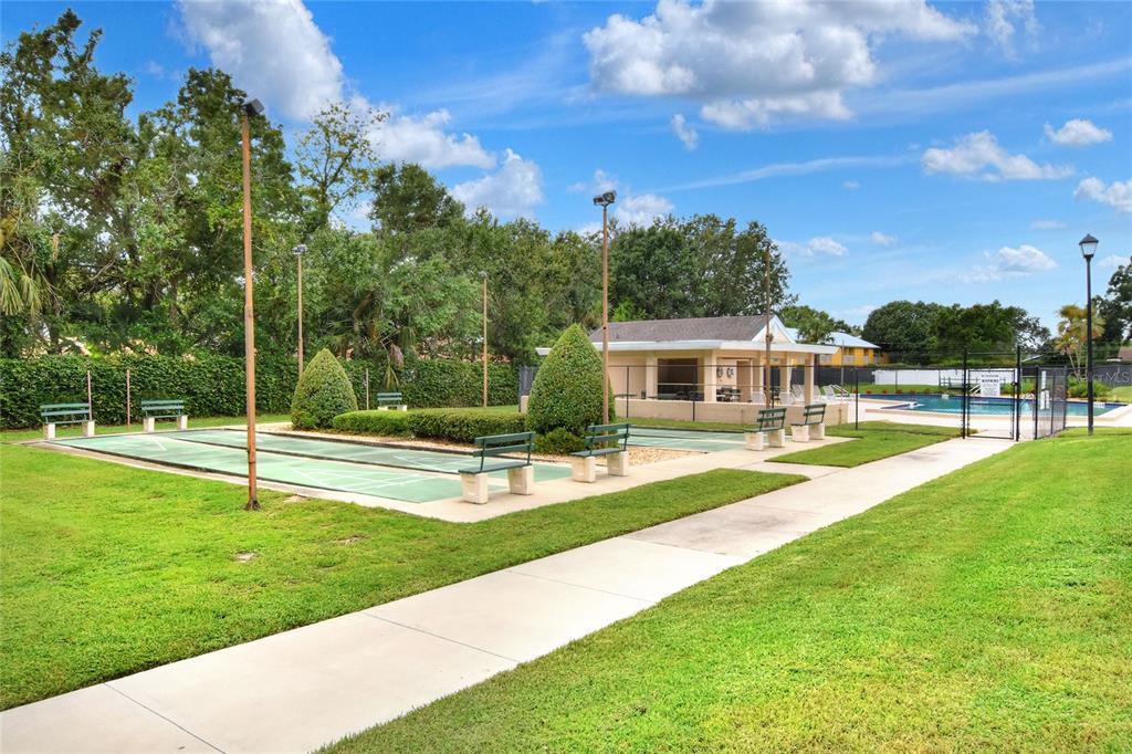 2025 Sylvester Road, Unit H3 Lakeland, FL 33803 - Photo 44 of 49 a view of a house with swimming pool and a yard