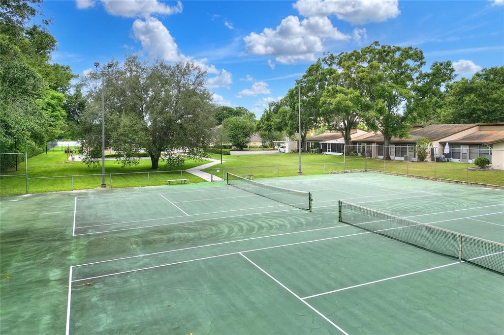 2025 Sylvester Road, Unit H3 Lakeland, FL 33803 - Photo 45 of 49 a view of an outdoor space and tennis court