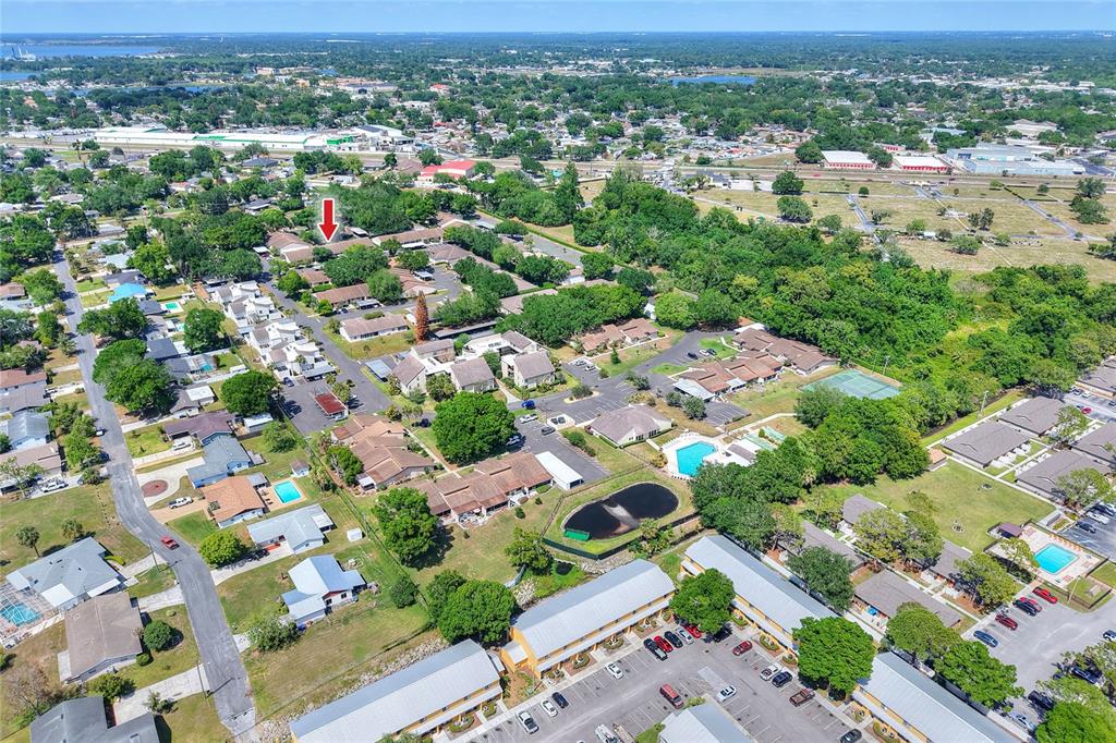 2025 Sylvester Road, Unit H3 Lakeland, FL 33803 - Photo 46 of 49 an aerial view of residential houses with outdoor space