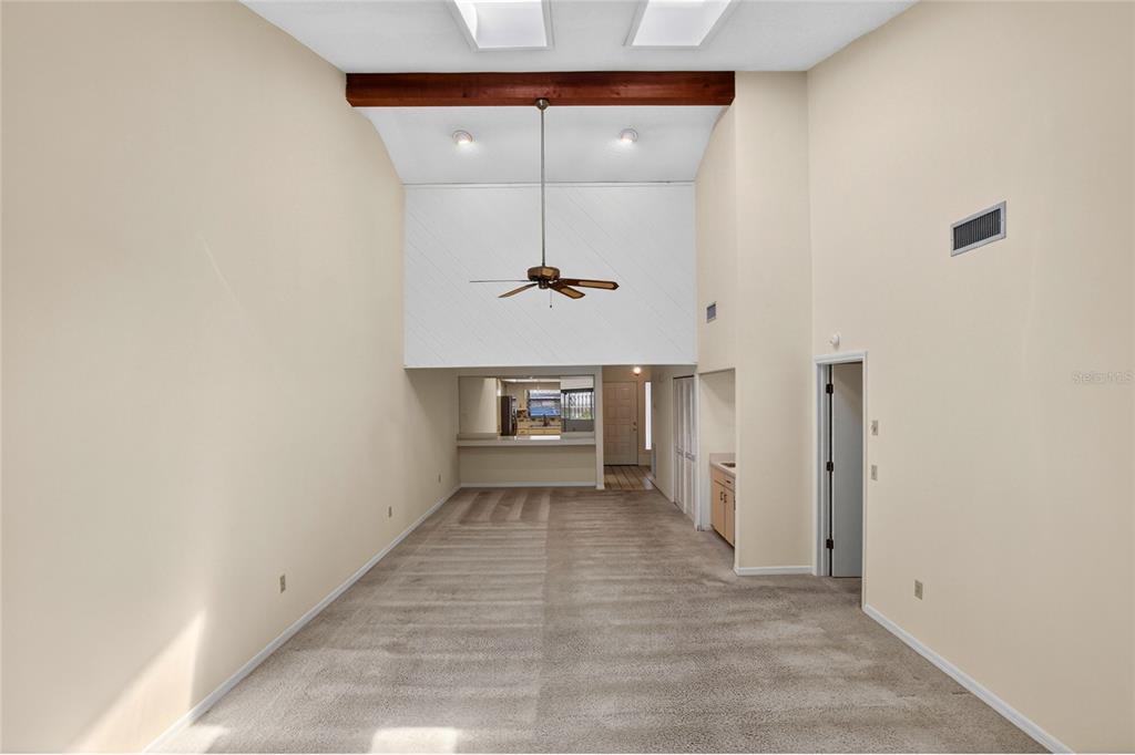 2025 Sylvester Road, Unit H3 Lakeland, FL 33803 - Photo 5 of 49 a view of a hallway with a chandelier