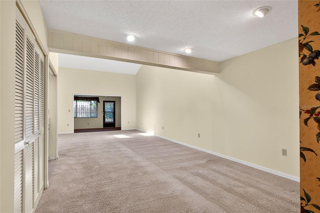 2025 Sylvester Road, Unit H3 Lakeland, FL 33803 - Photo 7 of 49 a view of an empty room with window and fireplace