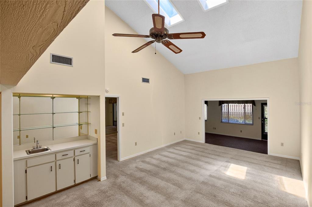 2025 Sylvester Road, Unit H3 Lakeland, FL 33803 - Photo 8 of 49 a view of a big room with windows and cabinet