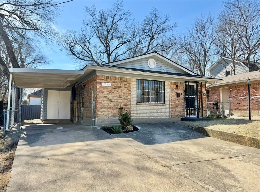 3543 Terrell Street Dallas, TX 75223 - Photo 1 of 26 a front view of a house with a yard