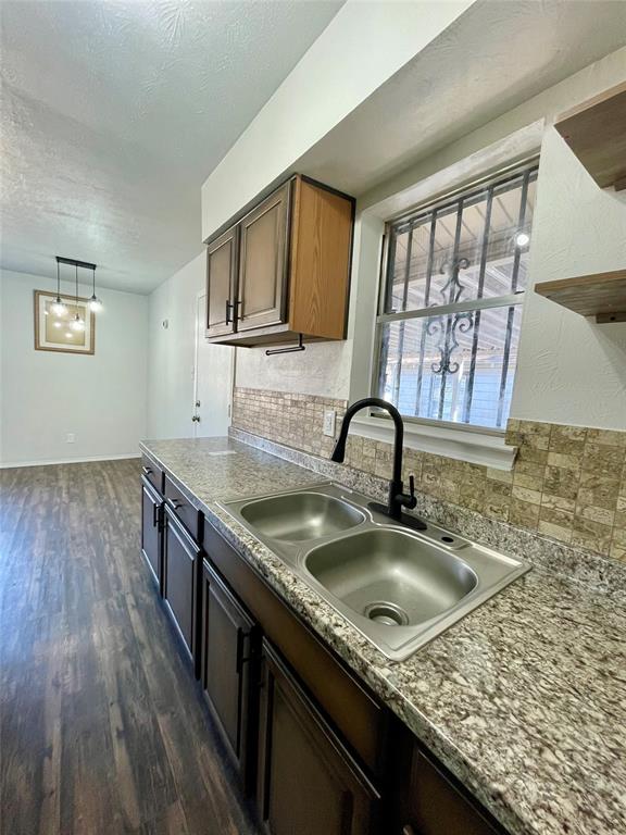 3543 Terrell Street Dallas, TX 75223 - Photo 12 of 26 a kitchen with a sink a counter space and cabinets
