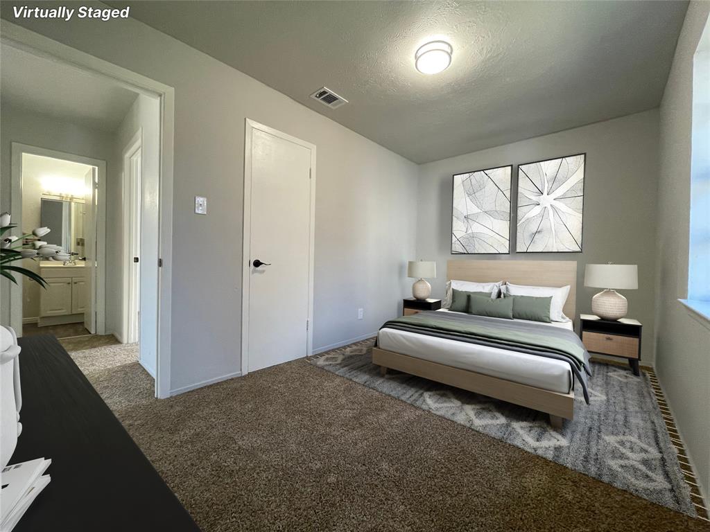 3543 Terrell Street Dallas, TX 75223 - Photo 14 of 26 a spacious bedroom with a bed and a couch