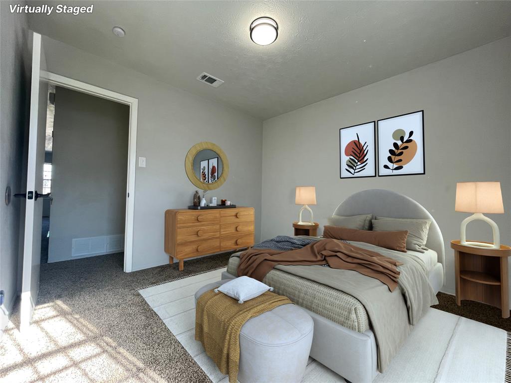 3543 Terrell Street Dallas, TX 75223 - Photo 15 of 26 a bedroom with a bed and a couch