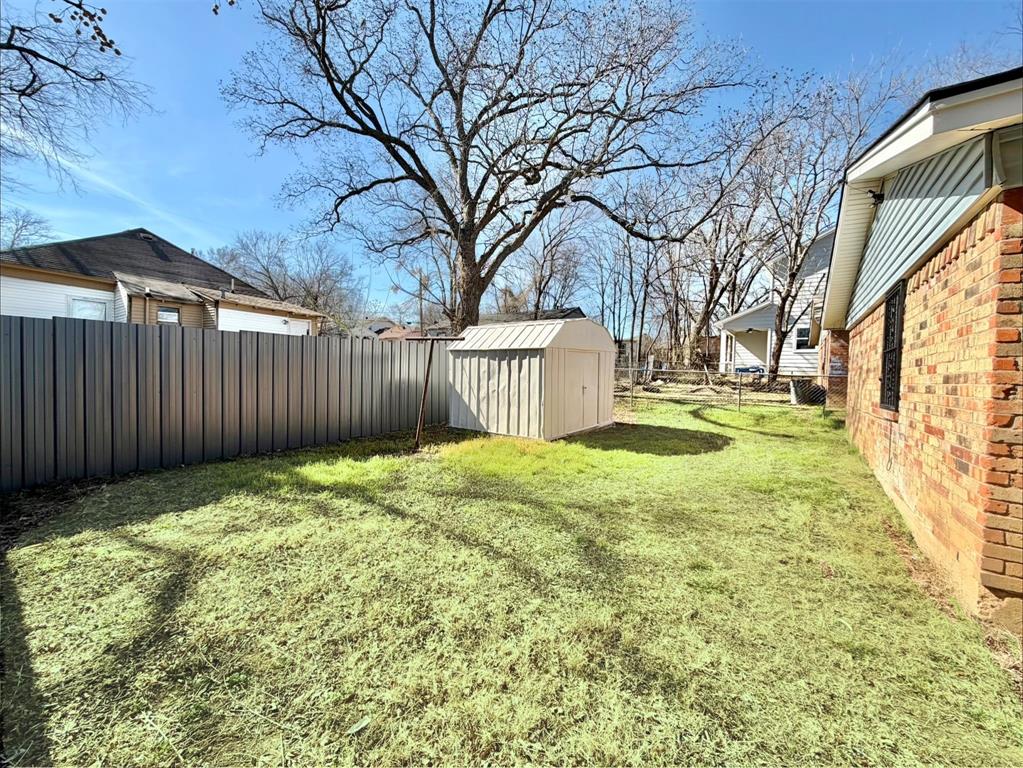 3543 Terrell Street Dallas, TX 75223 - Photo 26 of 26 a view of a backyard with wooden fence