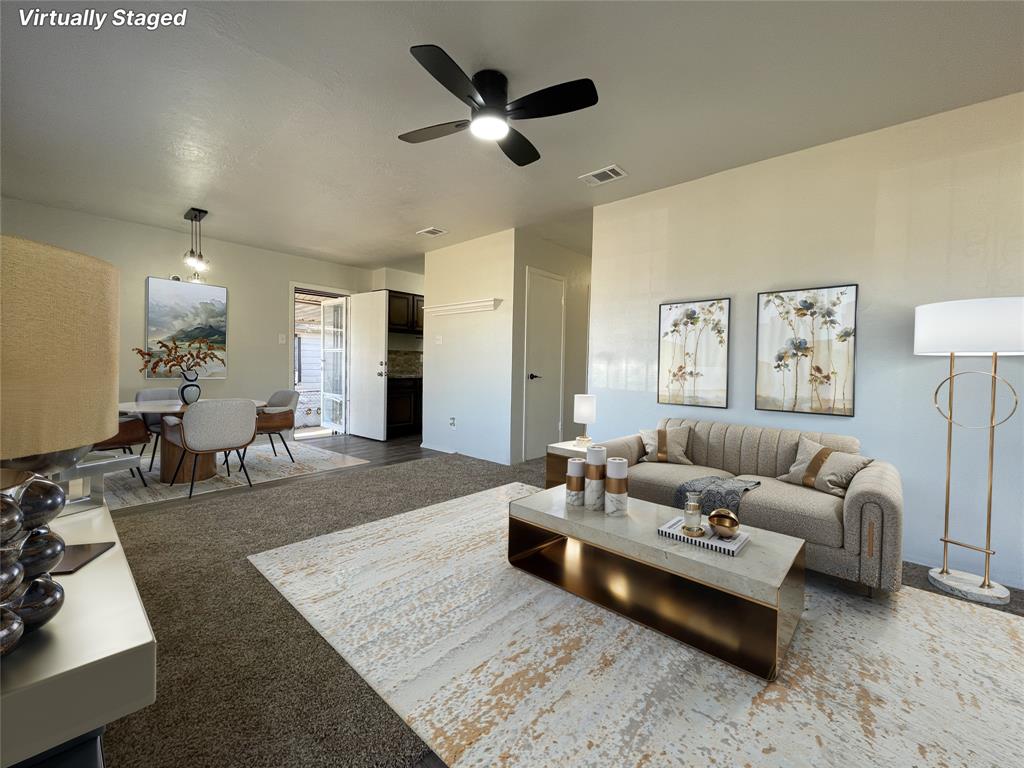 3543 Terrell Street Dallas, TX 75223 - Photo 3 of 26 a living room with furniture and a rug