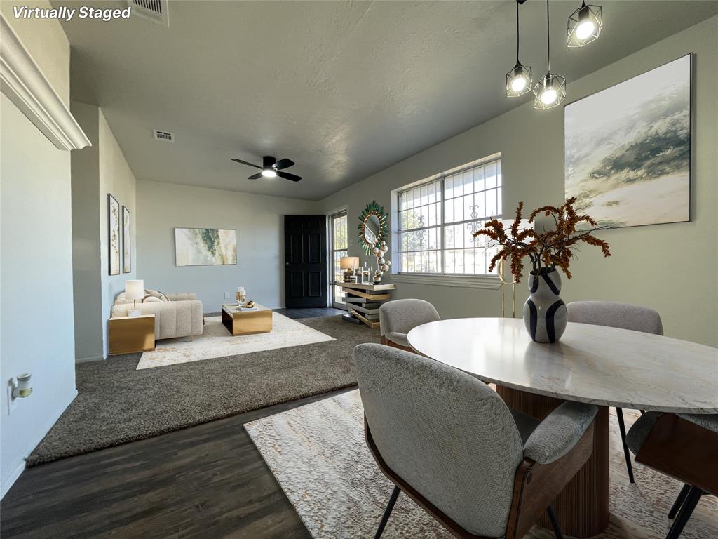 3543 Terrell Street Dallas, TX 75223 - Photo 5 of 26 a living room with furniture and a chandelier