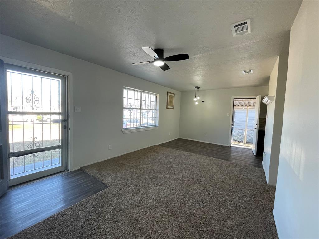 3543 Terrell Street Dallas, TX 75223 - Photo 6 of 26 wooden floor in an empty room with a window