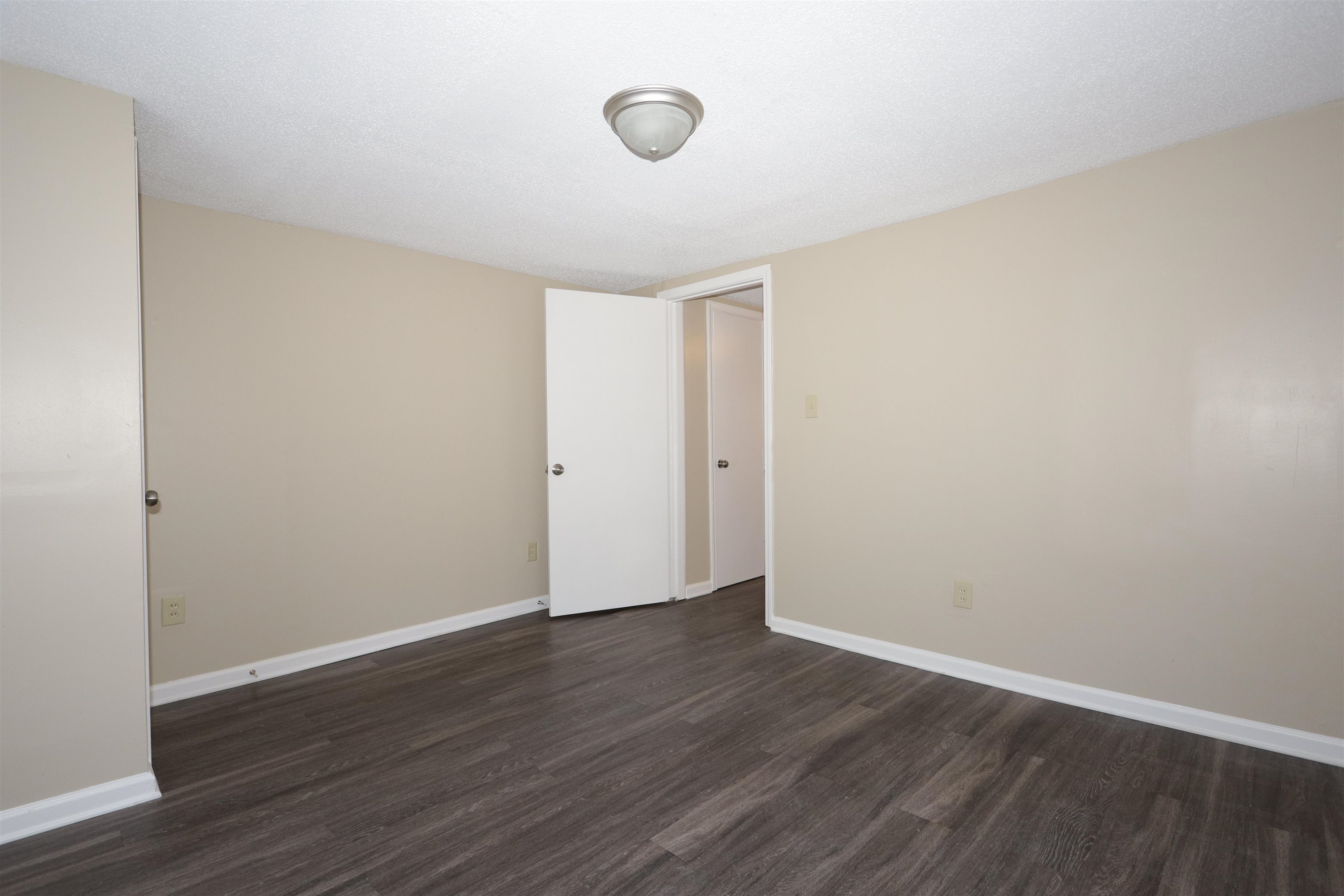 1825 Fields Road Memphis, TN 38109 - Photo 7 of 10 a view of an empty room with wooden floor