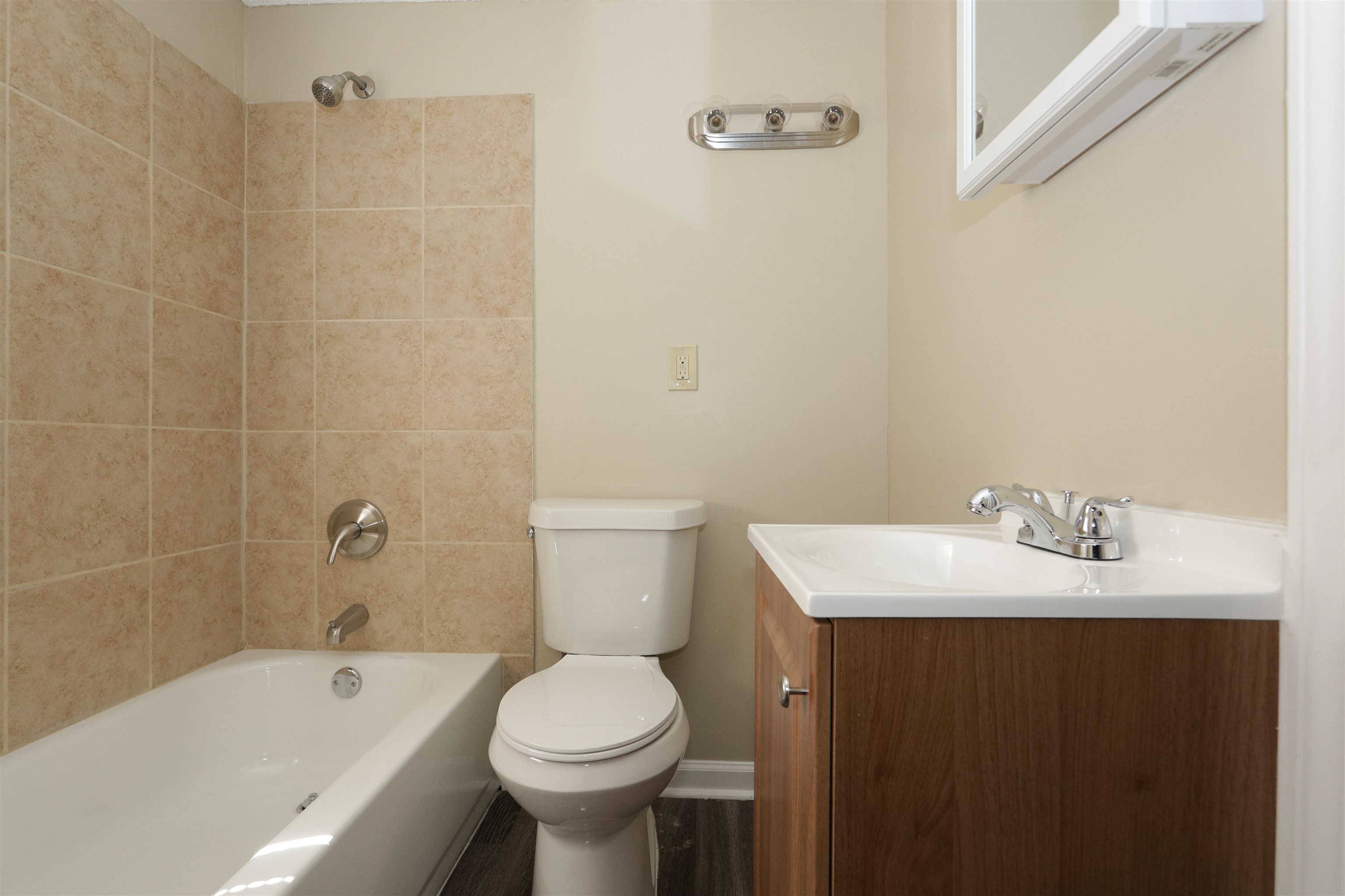 1825 Fields Road Memphis, TN 38109 - Photo 8 of 10 a bathroom with a sink a toilet and shower