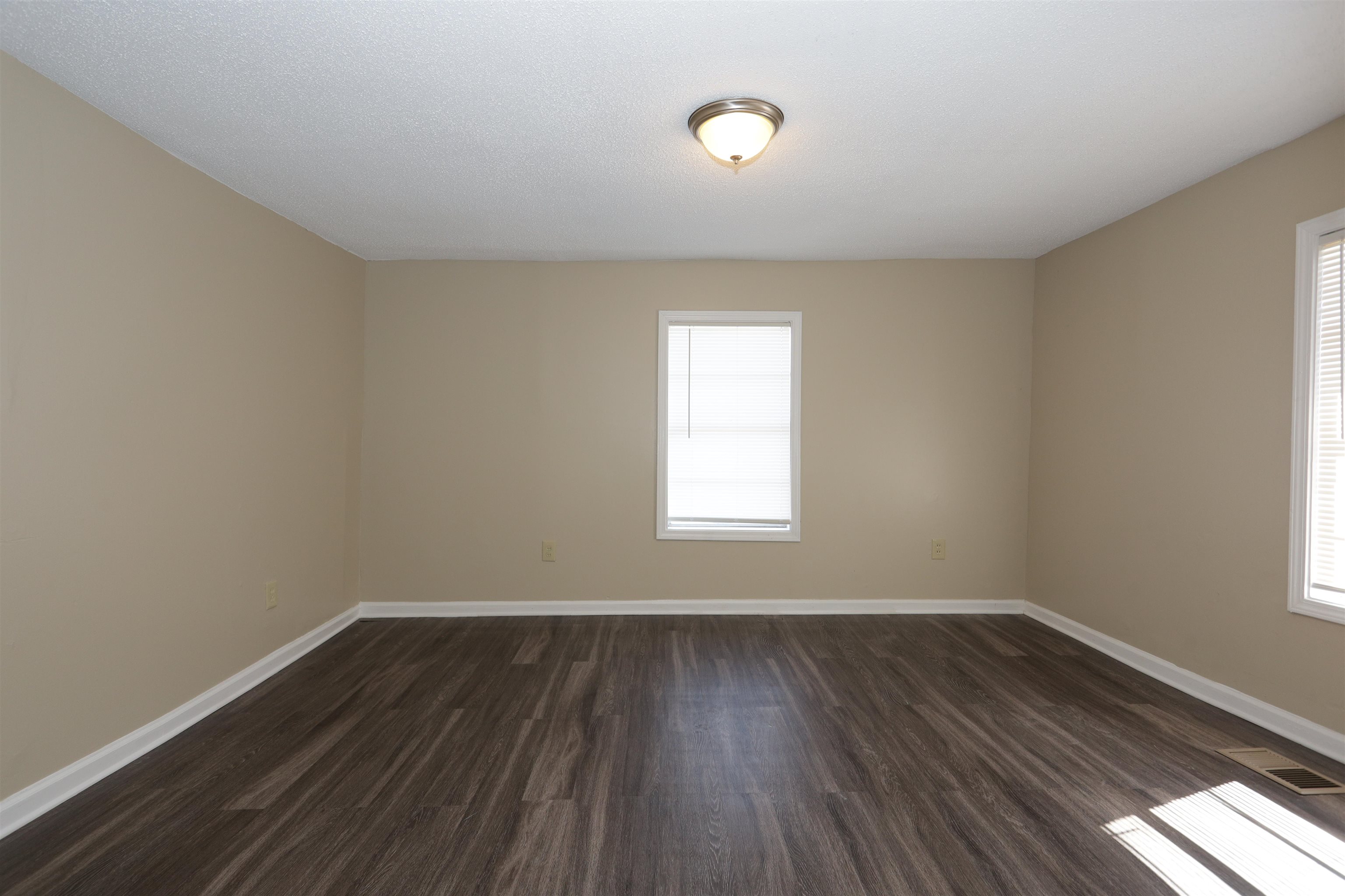 1825 Fields Road Memphis, TN 38109 - Photo 9 of 10 wooden floor in an empty room with a window