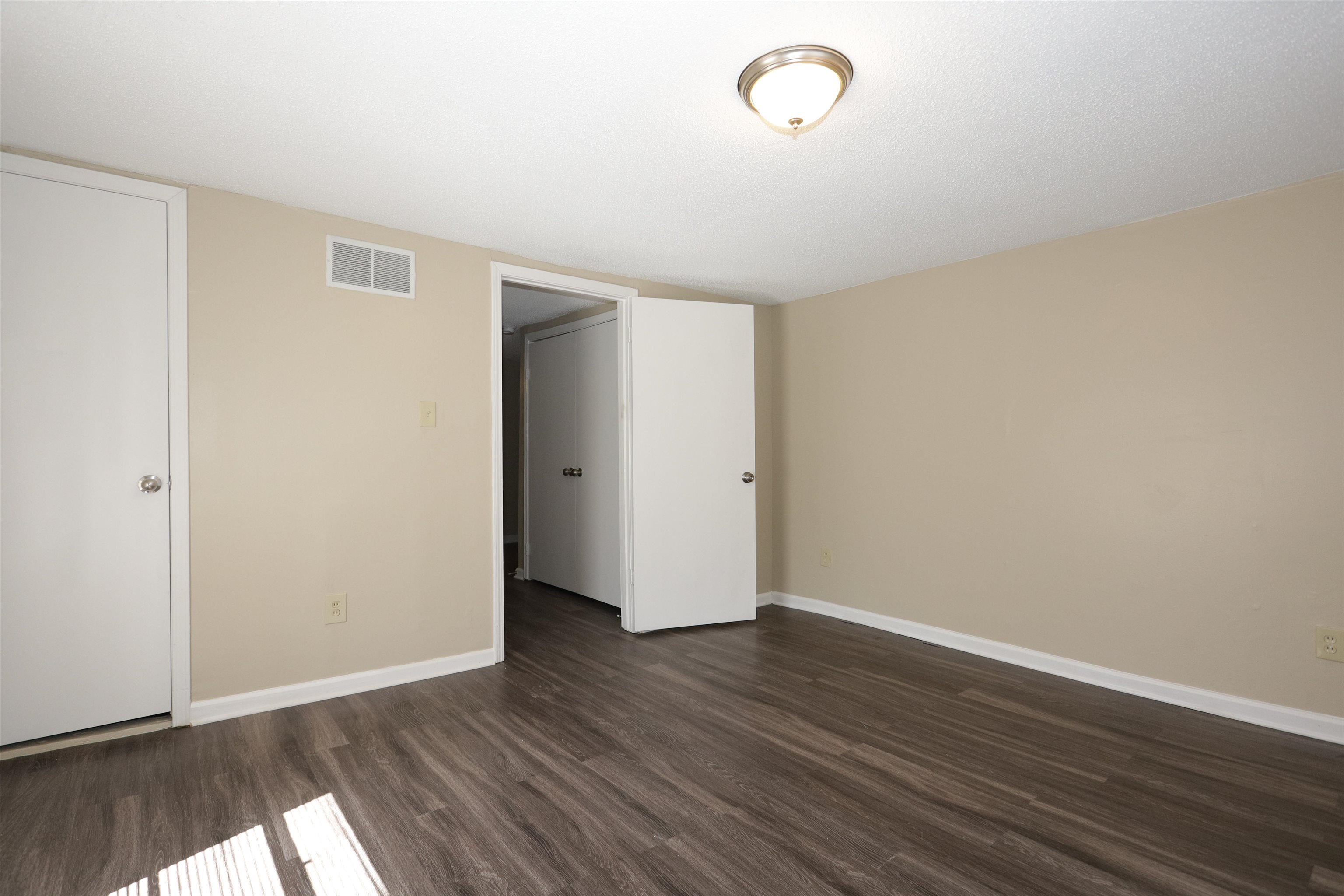 1825 Fields Road Memphis, TN 38109 - Photo 10 of 10 a view of an empty room with wooden floor