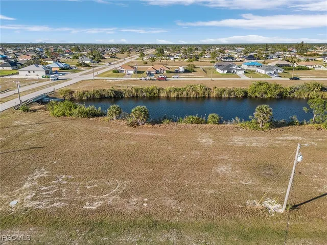 an aerial view of a houses with ocean view