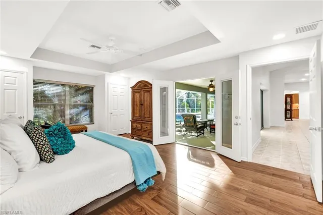 a bedroom with a large bed and a large window