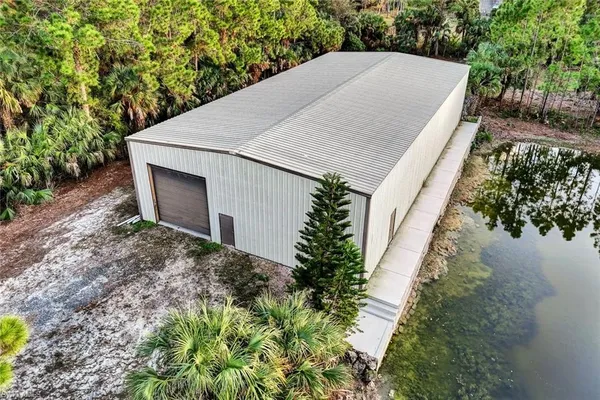 a aerial view of a house with a yard and plants