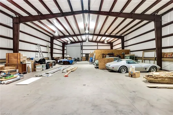 a view of parking garage with cars