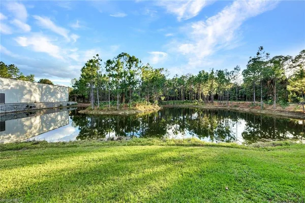 a view of a lake with a big yard