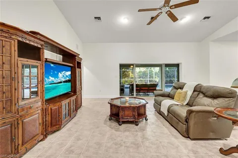 a bedroom with a large bed and a large window