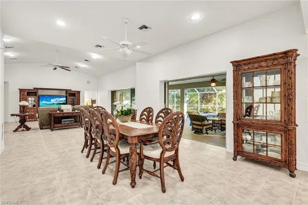 a view of a dining room and livingroom with furniture