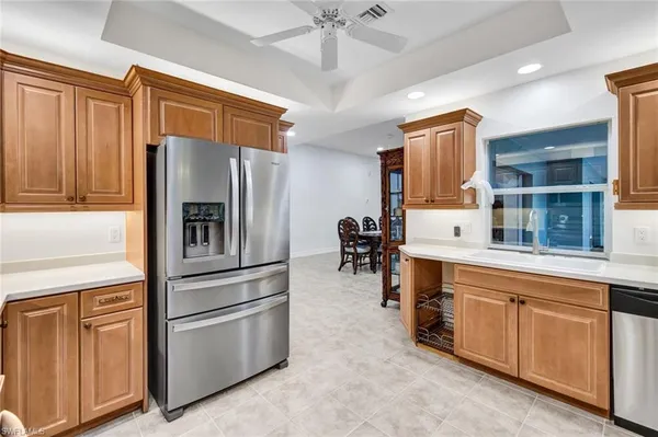 a kitchen with granite countertop cabinets and stainless steel appliances