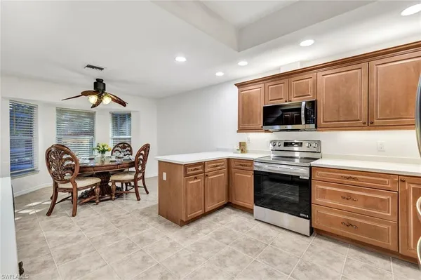 a kitchen with furniture a sink and a stove