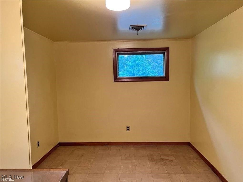 8581 Fair Road Strongsville, OH 44149 - Photo 12 of 20 Unfurnished room with baseboards and light flooring