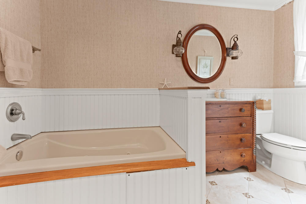 42 Gosnold Road Orleans, MA 02653 - Photo 15 of 42 a bathroom with a sink and a toilet