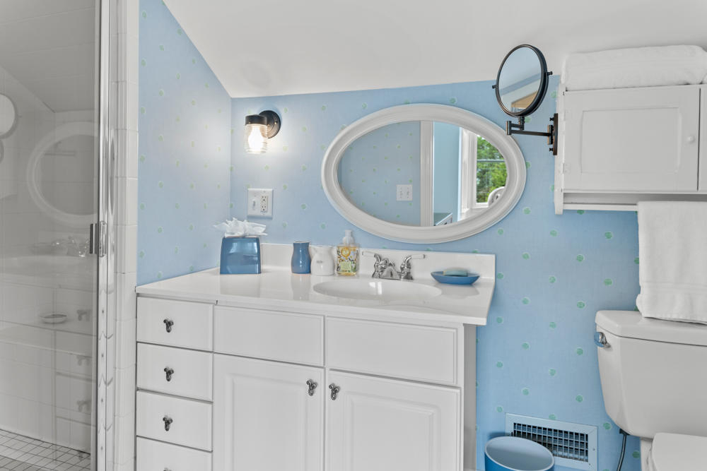 42 Gosnold Road Orleans, MA 02653 - Photo 24 of 42 a bathroom with a toilet a sink and a mirror