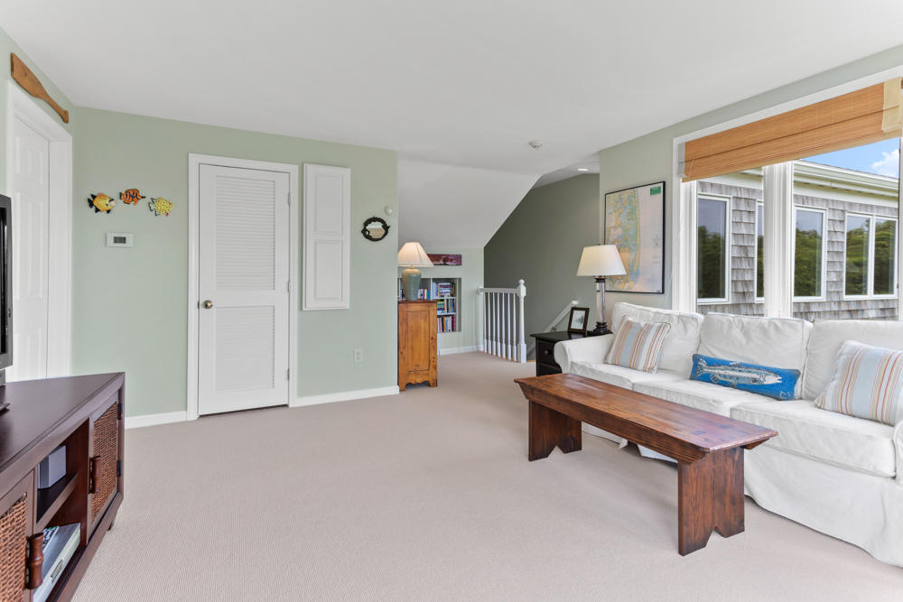 42 Gosnold Road Orleans, MA 02653 - Photo 26 of 42 a living room with furniture and a window
