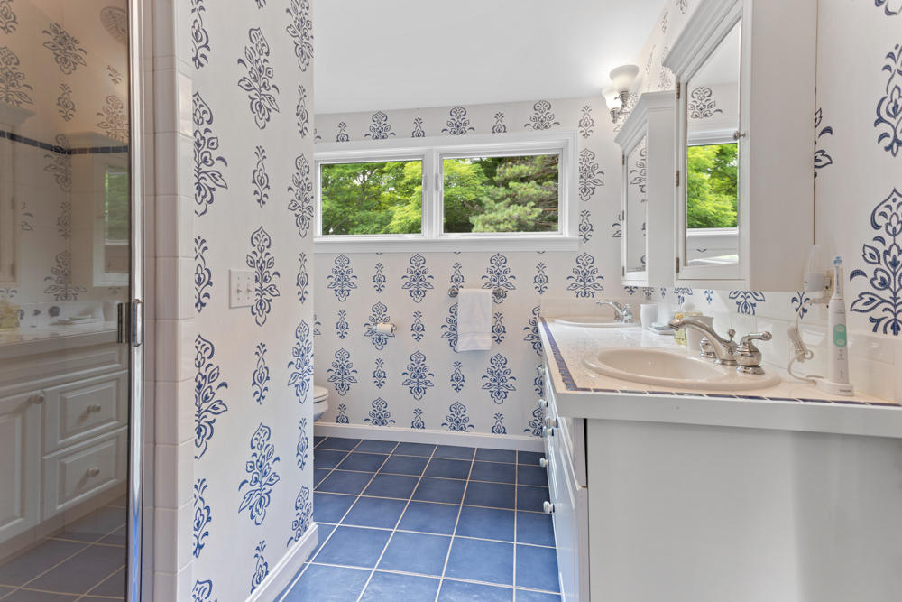 42 Gosnold Road Orleans, MA 02653 - Photo 27 of 42 a bathroom with a shower and a sink