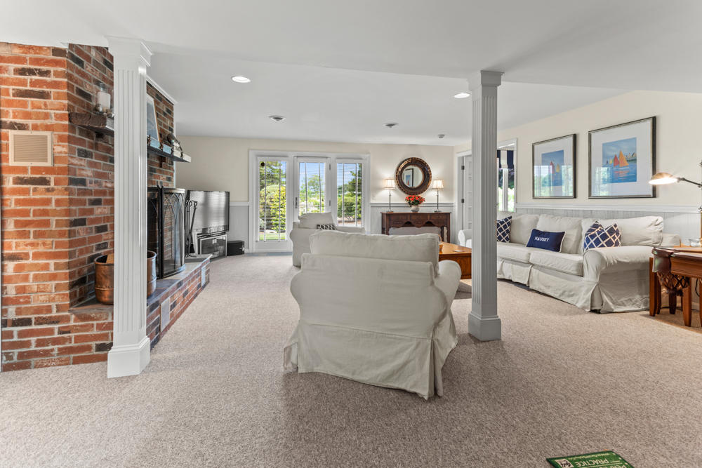 42 Gosnold Road Orleans, MA 02653 - Photo 30 of 42 a living room with furniture and a flat screen tv
