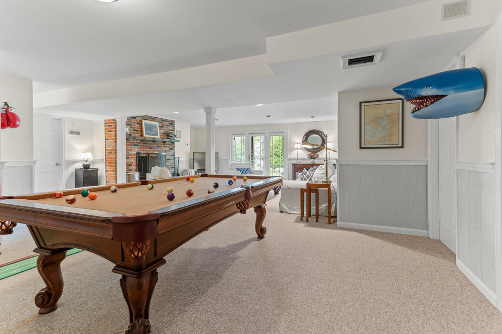 42 Gosnold Road Orleans, MA 02653 - Photo 32 of 42 a room with table and gym equipment