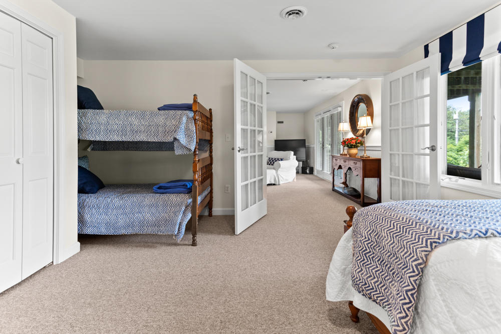 42 Gosnold Road Orleans, MA 02653 - Photo 35 of 42 a bedroom with furniture and a fireplace