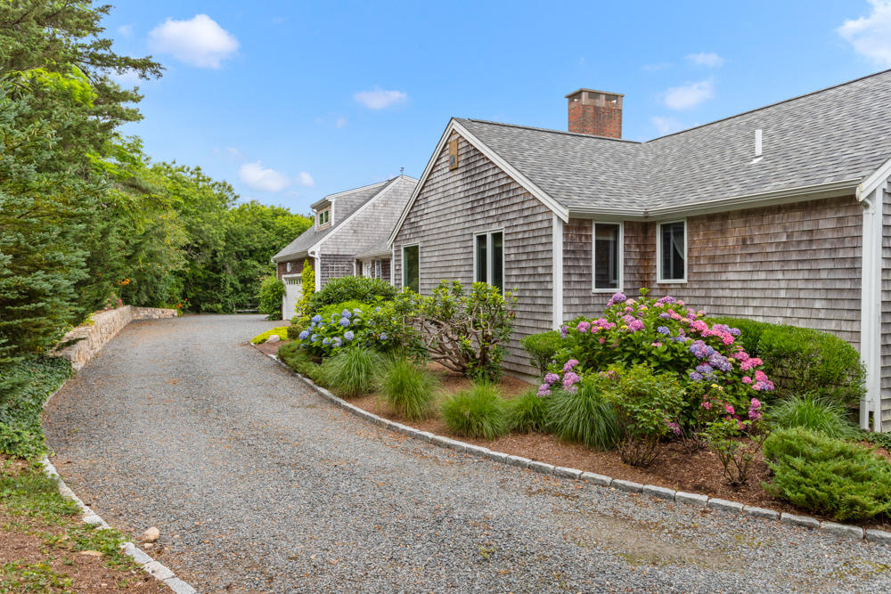 42 Gosnold Road Orleans, MA 02653 - Photo 36 of 42 a front view of house with a garden