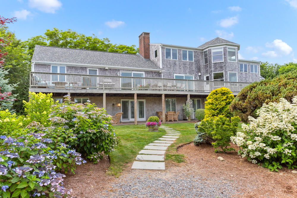 42 Gosnold Road Orleans, MA 02653 - Photo 37 of 42 a front view of a building with garden