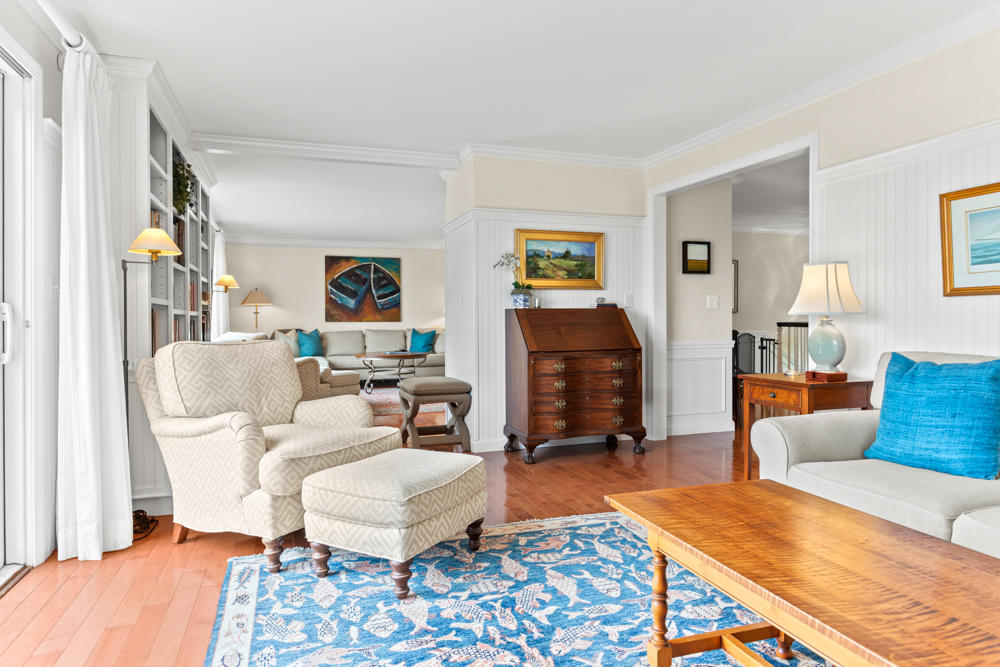 42 Gosnold Road Orleans, MA 02653 - Photo 8 of 42 a living room with furniture a rug and a fireplace