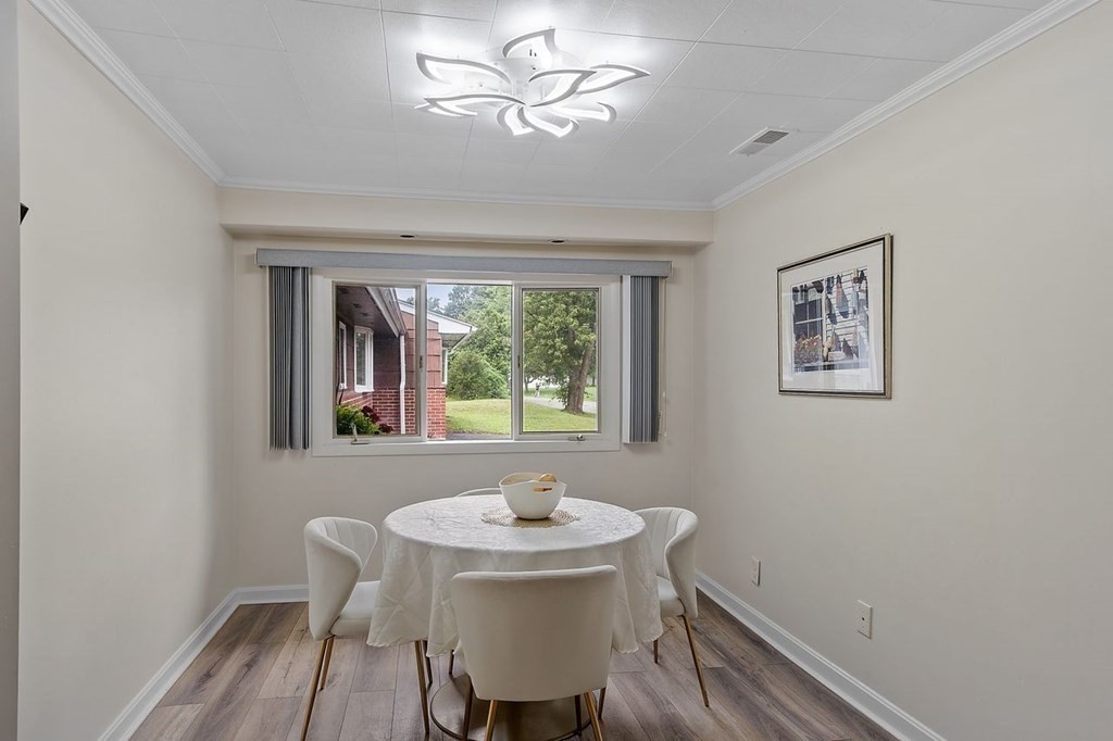 24 Algonquin Road Chelmsford, MA 01824 - Photo 11 of 38 a dining room with furniture and window