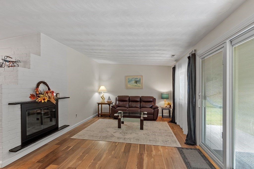 24 Algonquin Road Chelmsford, MA 01824 - Photo 14 of 38 a view of a workspace with furniture and wooden floor