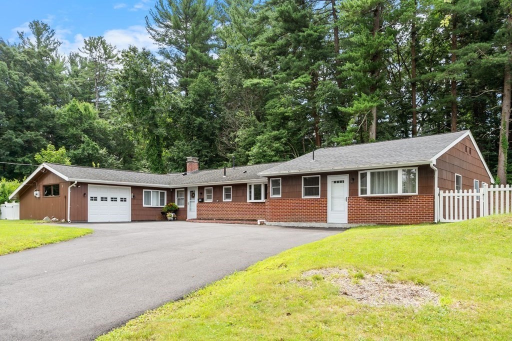 24 Algonquin Road Chelmsford, MA 01824 - Photo 2 of 38 a front view of a house with a yard