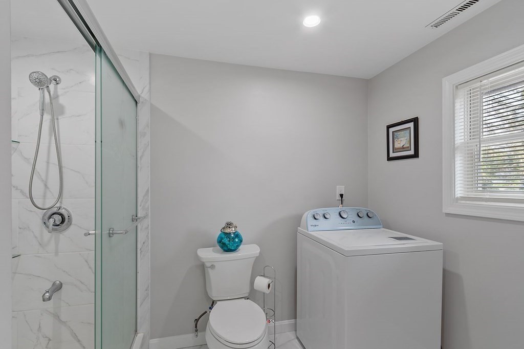 24 Algonquin Road Chelmsford, MA 01824 - Photo 21 of 38 a bathroom with a sink toilet and shower