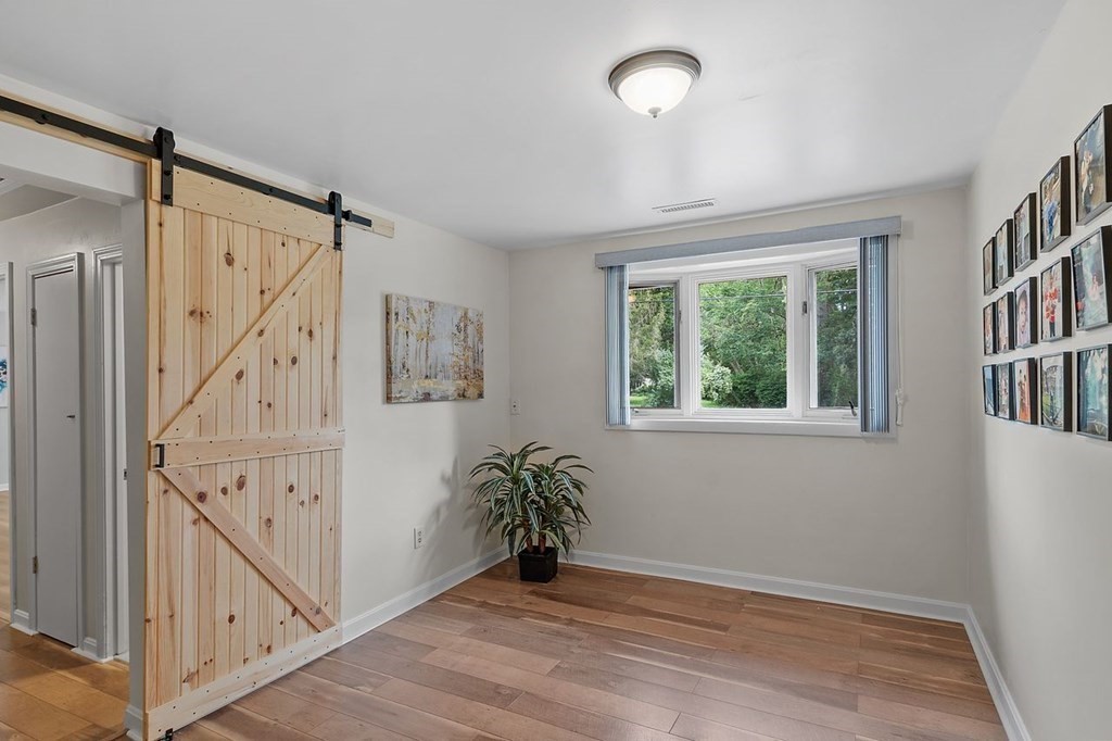 24 Algonquin Road Chelmsford, MA 01824 - Photo 22 of 38 a view of entryway with stairs and wooden floor