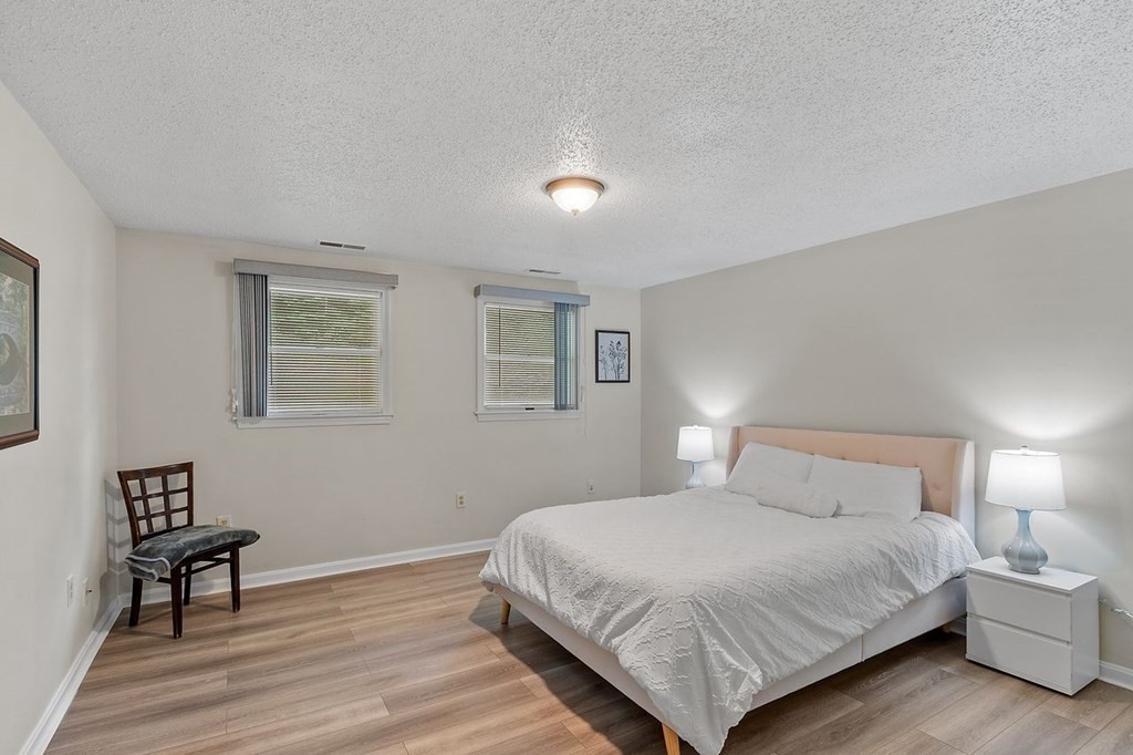 24 Algonquin Road Chelmsford, MA 01824 - Photo 24 of 38 a bedroom with a bed and a table