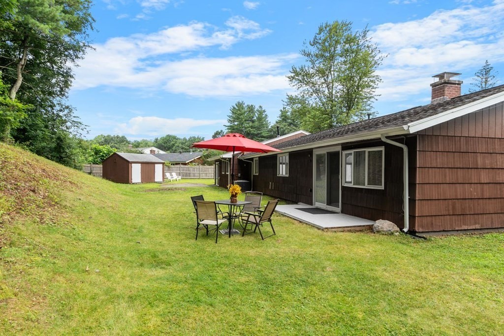 24 Algonquin Road Chelmsford, MA 01824 - Photo 3 of 38 a view of a house with backyard porch and sitting area